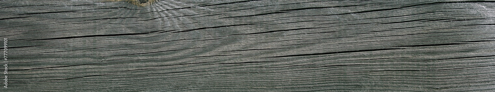 Texture of an old weathered cracked wooden board. Natural wide Background. Texture of an old weathered cracked wooden board. Natural wide Background.