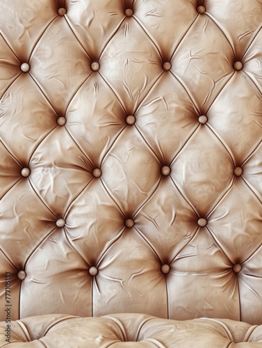 Luxurious diamond-patterned button-tufted leather in a warm, golden beige tone, creating a sophisticated and visually striking backdrop for product or lifestyle shots.