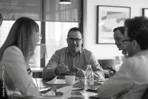 A group of financial advisors sitting around a table, engaged in a discussion and brainstorming session about investment strategies and financial planning
