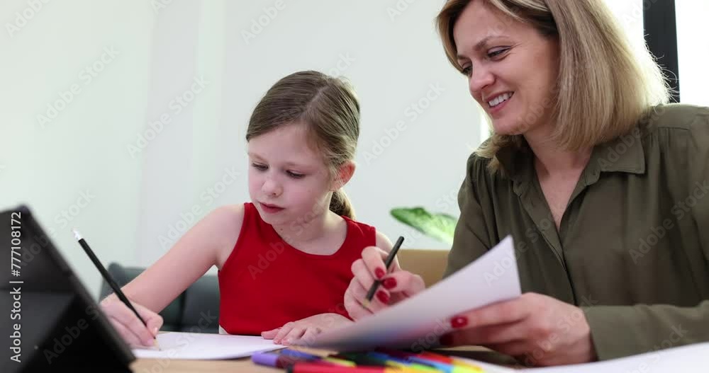 Little girl studying with teacher at lesson of fine arts in school 4k movie slow motion. Education for preschoolers concept Little girl studying with teacher at lesson of fine arts in school 4k movie slow motion. Education for preschoolers concept