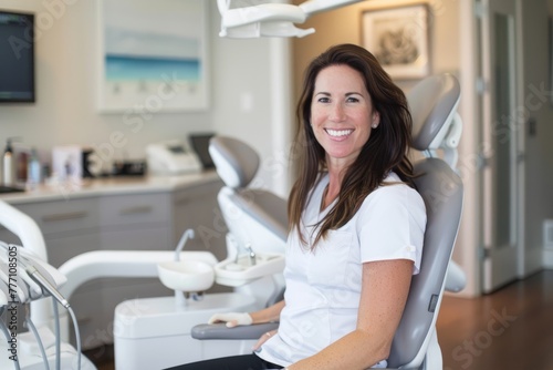 A woman sits in a chair in a dentists office, waiting for her appointment