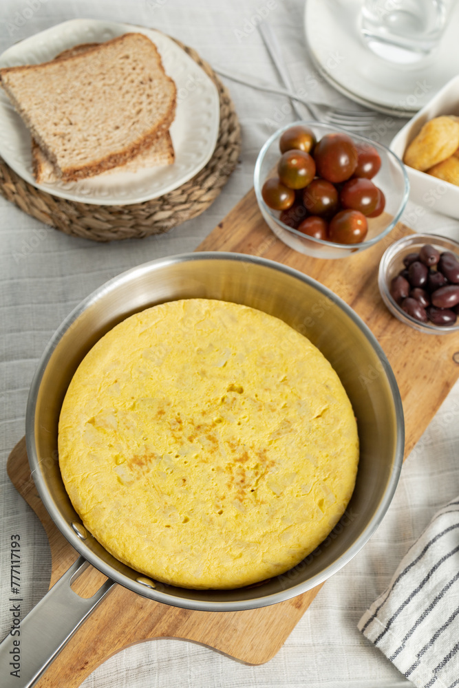 Tortilla de patata (Spanish omelette), a typical dish of Spanish cuisine made with eggs and potatoes Tortilla de patata (Spanish omelette), a typical dish of Spanish cuisine made with eggs and potatoes