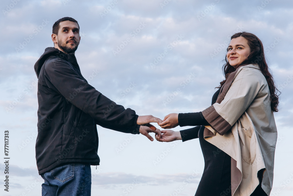 A Man and a Woman Holding Hands. Lower View A Man and a Woman Holding Hands. Lower View
