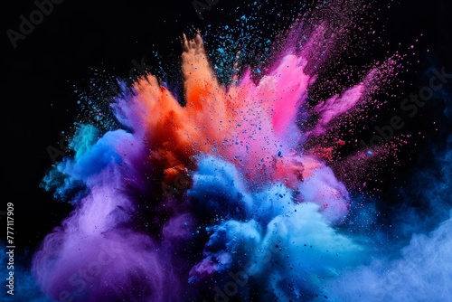Colorful powder bursts in the air, displaying bright hues and dynamic movement against a black backdrop photo
