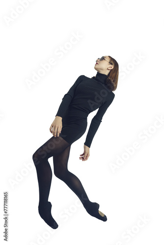 a young ballerina in a black dress and sunglasses total black demonstrates choreography on pointe shoes, isolated on transparent background, png