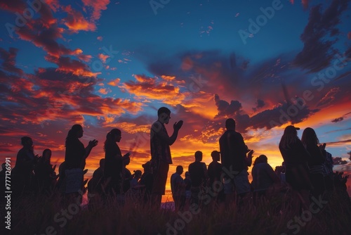 Outdoor Prayer Gathering Silhouetted at Sunset