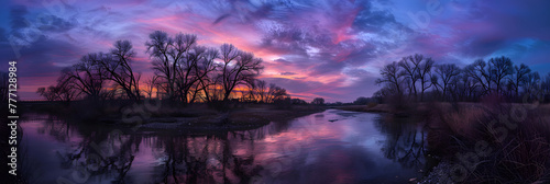 Twilight Serenity: A Tranquil Evening Landscape of River, Sky, and Silhouetted Trees © Millie