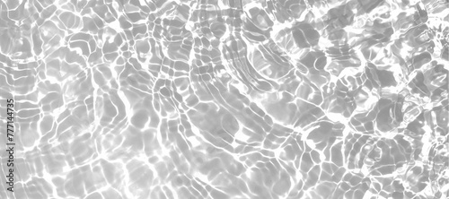 Clear white water surface with beautiful splashing ripples and bubbles. Natural reflection sunlight on water texture. Abstract summer banner background photo