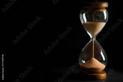 Hourglass on a black background.