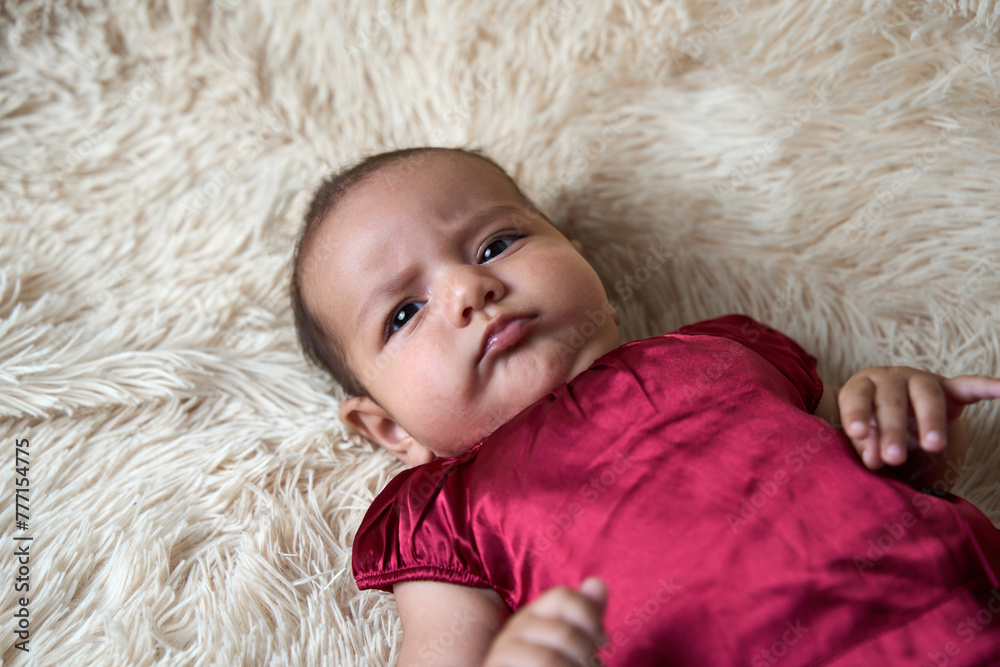 Portrait of a newborn baby lying on a fluffy blanket Portrait of a newborn baby lying on a fluffy blanket