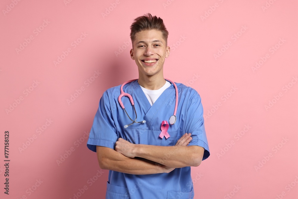 Mammologist with pink ribbon on color background. Breast cancer awareness Mammologist with pink ribbon on color background. Breast cancer awareness