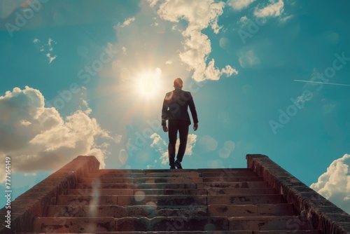 Businessman climbing the old concrete stairs with sky cloudscape sunlight background photo