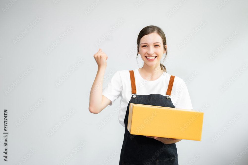 Caucasian woman smiling and holding package parcel box isolated on white background, Delivery and shipping service Caucasian woman smiling and holding package parcel box isolated on white background, Delivery and shipping service