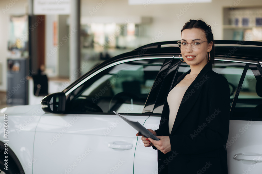 Professional salesperson working in car dealership