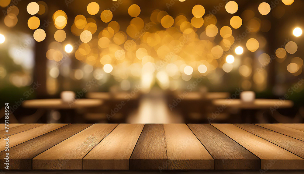 empty wood table top on blur light gold bokeh of cafe restaurant in dark background empty wood table top on blur light gold bokeh of cafe restaurant in dark background