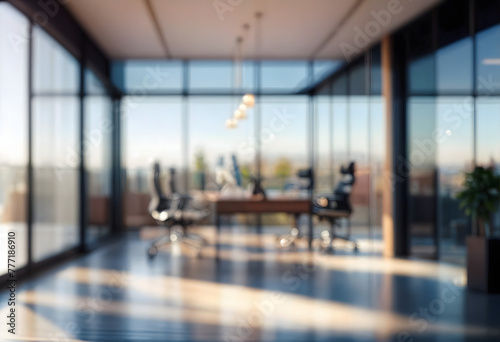 The image shows large  empty office space with a glass wall and floor. There are chairs and a table in the distance  and a potted plant near the right wall. The room is well-lit  with sunlight stream