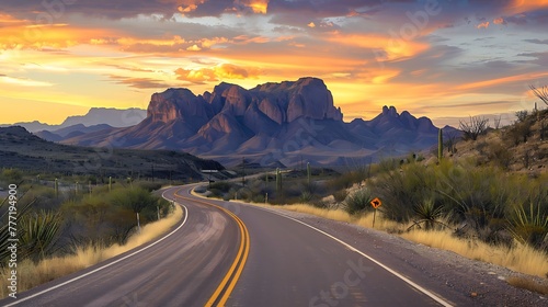 Two lane highway at dusk in the Chisos Mountains in Big Bend Park photo