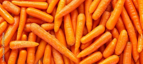 Vibrant texture background of large fresh organic orange carrots, a bountiful and healthy harvest photo