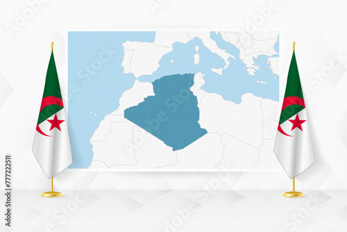 Map of Algeria and flags of Algeria on flag stand.