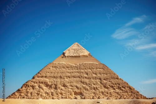 The Great Pyramid against a clear blue sky.