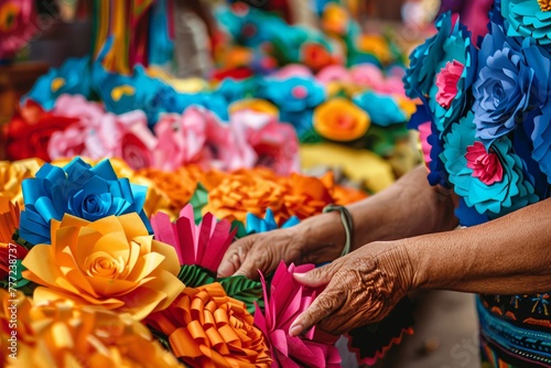 Market stallholder sells handmade paper flowers in brilliant hues the vibrant backdrop for Cinco De Mayo celebrations with empty space for text