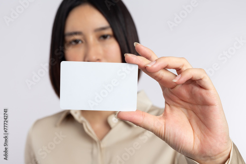 Asian businesswoman holding business card isolated on white background
