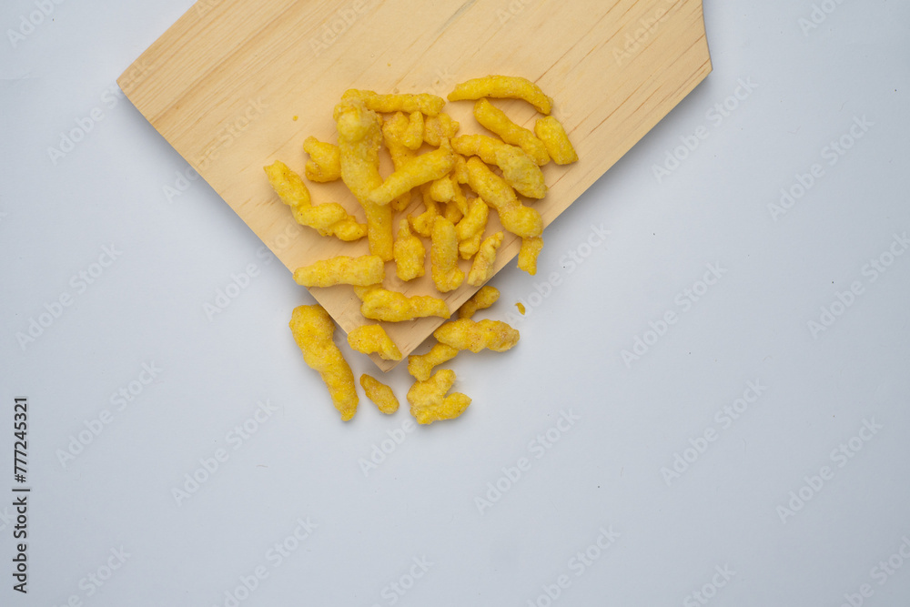 corn chips snack on wooden cutting board isolated on white background. corn chips snack on wooden cutting board isolated on white background.