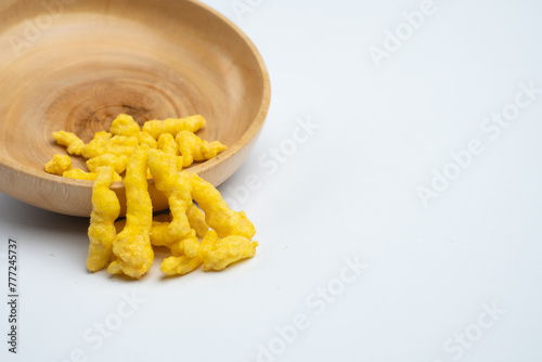 corn chips snack in wooden bowl isolated on white background.