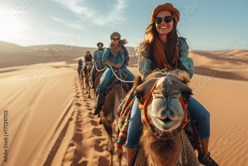 A band of cheerful tourists riding camels in a desert setting, indicating group travel and exploration © Larisa AI