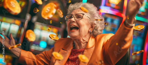 Elderly woman rejoices next to slot machines and flying coins, casino winnings photo