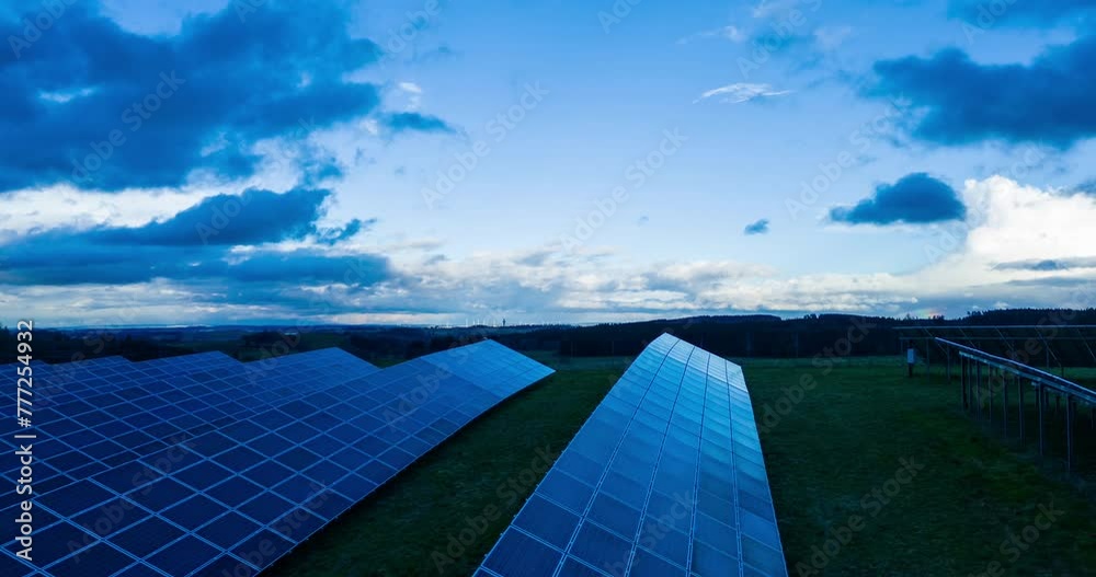 modern solar panels in the rural landscape (aerial timelapse)	