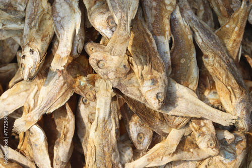 close up of sea dried fish named poppa. Fresh salted fish in local market photo
