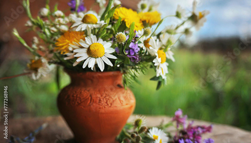 Flowers from the field in a clay vase. Spring motif. AI generative.