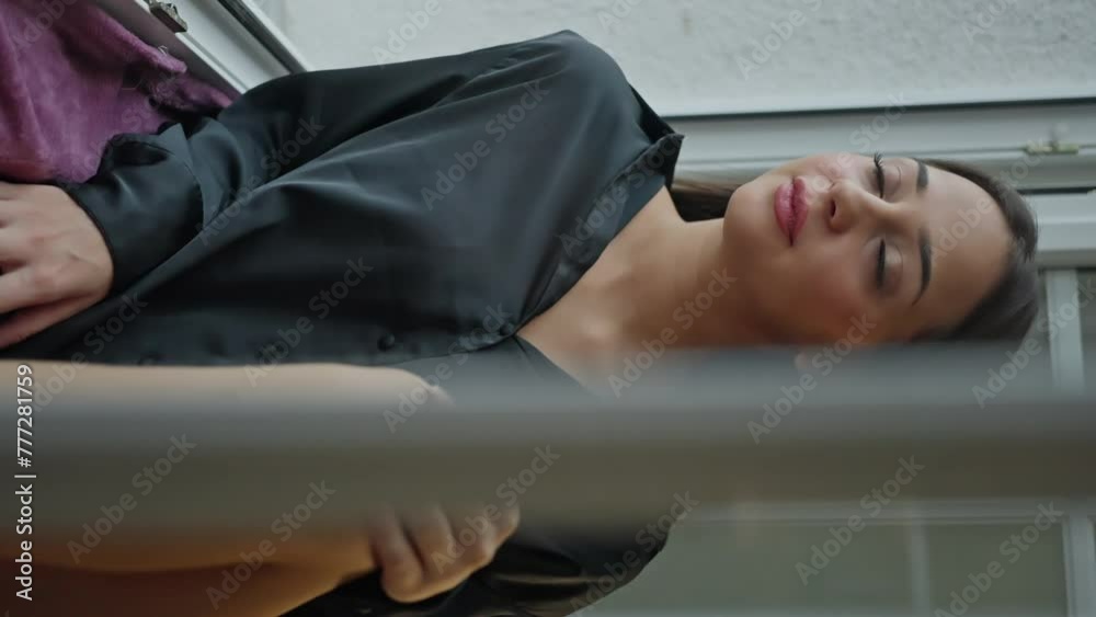 A woman sits on the window, gazing out towards the sky. She rests her thigh on the window sill. She stands by the hardwood window, gazing at the sky with a thoughtful gesture. Slow motion A woman sits on the window, gazing out towards the sky. She rests her thigh on the window sill. She stands by the hardwood window, gazing at the sky with a thoughtful gesture. Slow motion