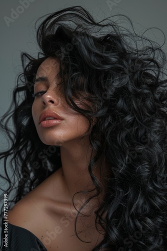 woman with long angular hair blowing out the curls, in the style of rich textures, hurufiyya, salon kei, 