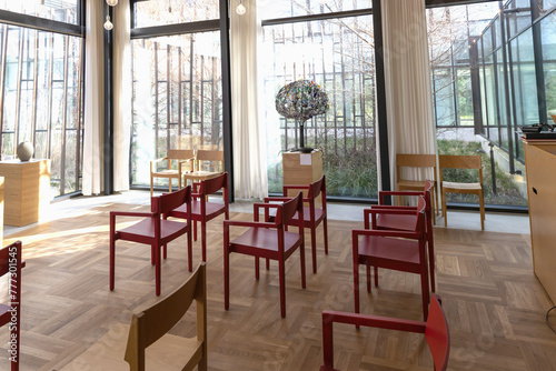 Church room for prayer and privacy with a large cross and chairs for visitors. photo