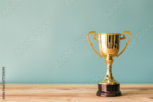 Golden trophy on table with copy space