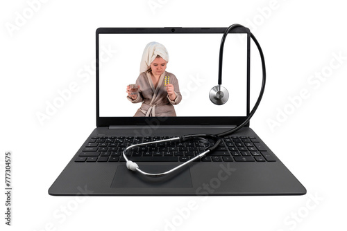 Laptop and medical stethoscope on a transparent background. On the laptop screen - a girl with cold symptoms holds a blister with pills and a glass of water