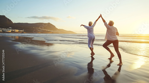 Elderly duo engages in serene morning stretches at seashore for healthy aging.
