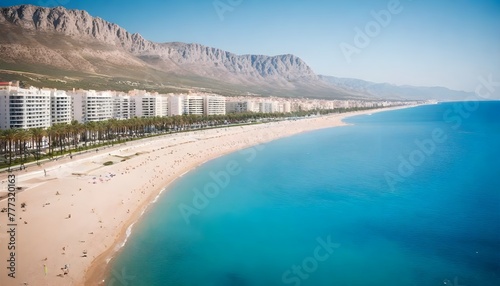 View to beautiful Albir town with main boulevard promenade, seaside beach and Mediterranean sea. Albir is small resort city between Altea and Benidorm, Alicante province
