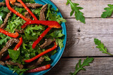 Healthy salad with beef red pepper