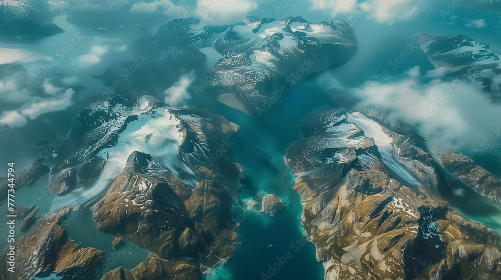 satellite view of a picturesque island with snowy summits surrounded by the ocean