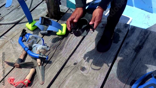 Diver checking the materials to scuba diving on a lake