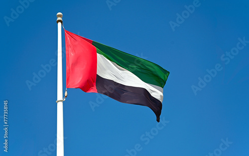 Flag of United Arab Emirates against blue sky © Savvapanf Photo ©