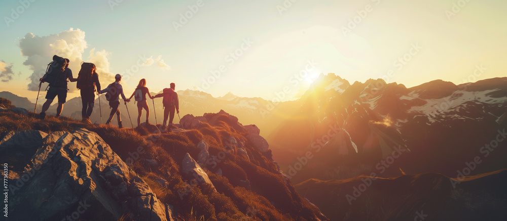 Silhouette of teamwork friendship climbing and hiking the top of mountain help each other