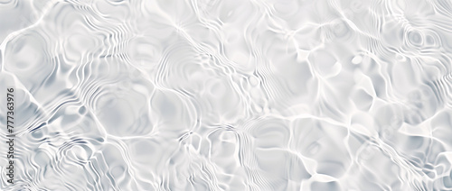 Water texture background. Surface of the swimming pool. Abstract wite color water wave, pure natural swirl pattern texture, banner background. Glitter of water in the sunlight.