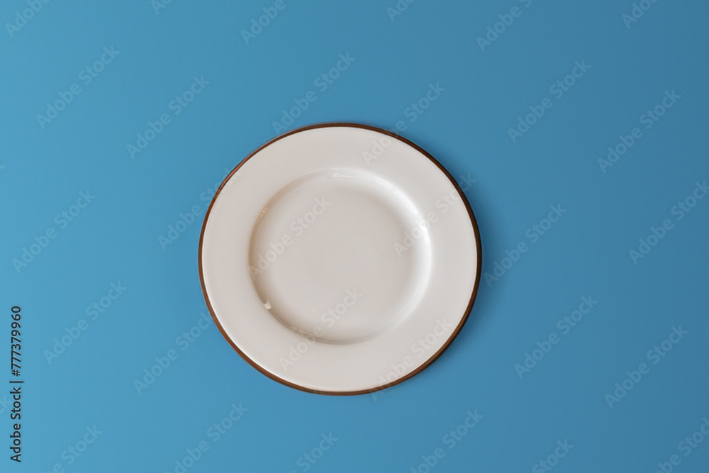 Ceramic white flat plate for food on the table Ceramic white flat plate for food on the table
