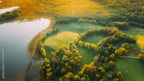 Aerial View Of Green Forest And Meadow Hill Landscape Near River. Top View Of Beautiful Nature From High Attitude. Bird's Eye View. © Grigory Bruev