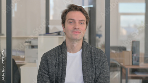 Portrait of Casual Young Man Shaking Head in Approval