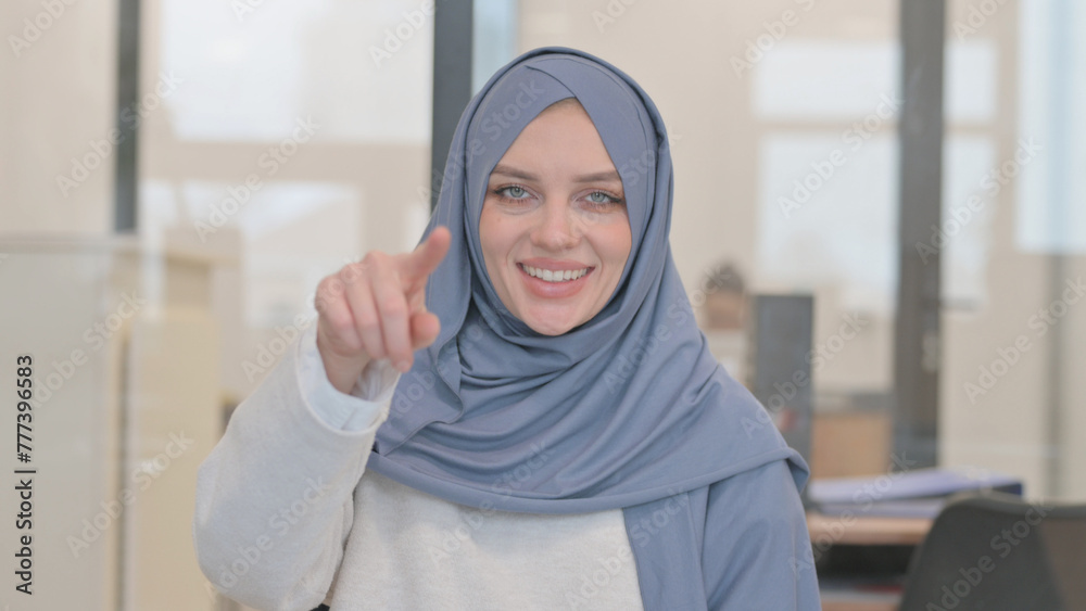 Portrait of Arab Woman Pointing at Camera